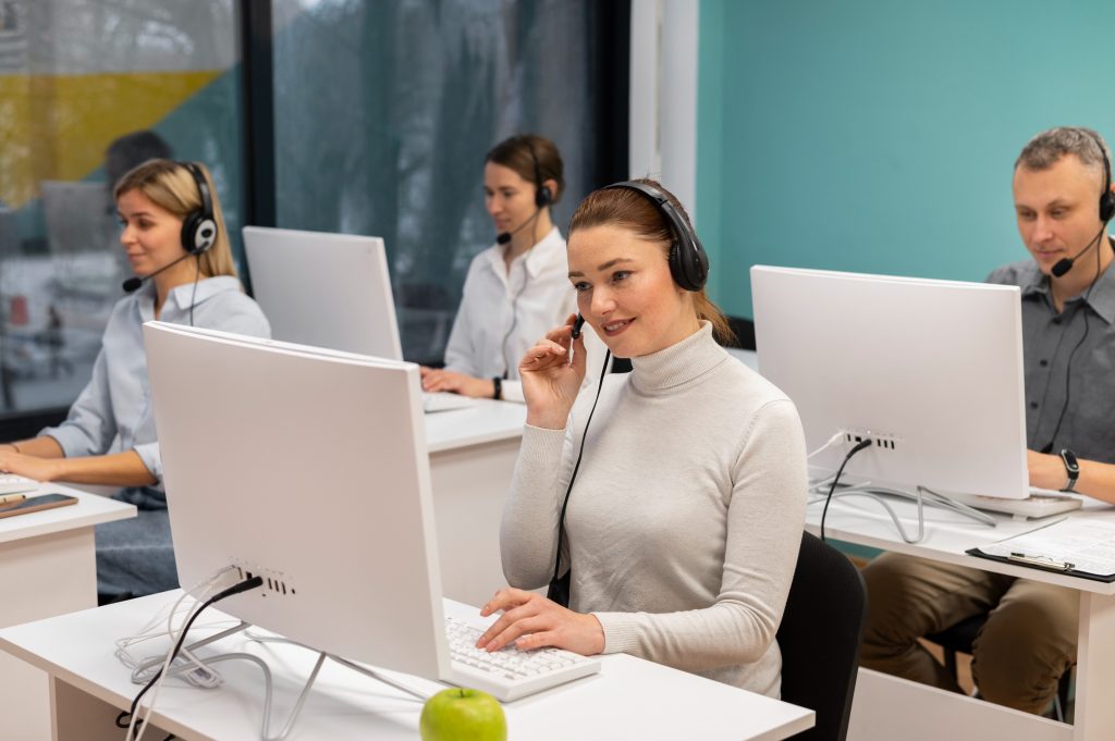 colleagues-with-headphones-working-call-center-office-1024x681 colleagues with headphones working call center office 1024x681 1